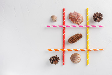 Game TIC TAC toe. Winter wins over summer. Seasonal conception. Top view, flat lay with copy space...