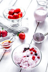 organic homemade ice cream in glass bowl on wooden background