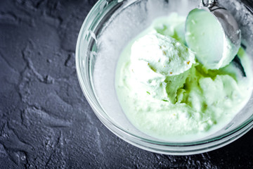 organic ice cream homemade process on dark background with hands