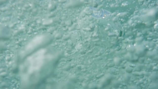 Bubbles rising to the surface. Air bubbles in water in sea (underwater shot), good for backgrounds. Slow motion.
