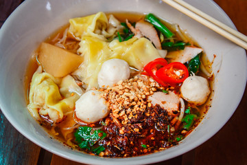 Noodle and dumpling with barbecued red pork.