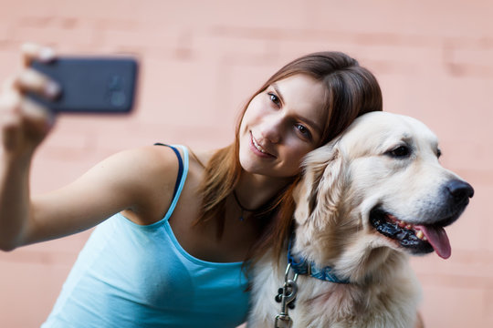 Photo of woman doing selfie with dog