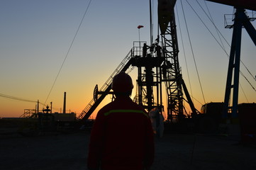 field oil workers at work