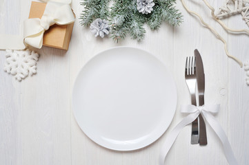 Christmas table setting on white wooden table. Christmas card template with space for your text, top view