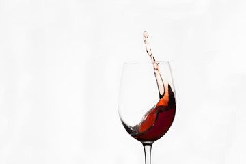 photo of a splash of red wine in a glass