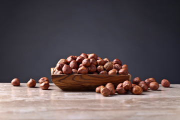 Hazelnuts in old wooden dish
