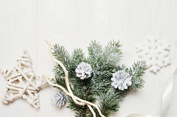 Mockup christmas branch or new year frame composition with space for your text. christmas decorations on white wooden background. holiday and celebration concept for postcard or invitation. top view