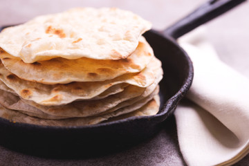 Indian flatbread chapati, green onion. Color surge trend.