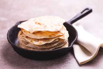 Indian flatbread chapati, green onion. Color surge trend.