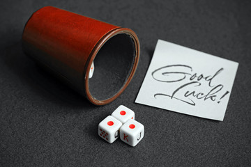 Fototapeta na wymiar game of dice and note