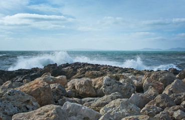Waves splash onto rocks