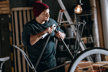 Worker repairing bike