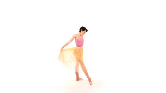 ballerina is dancing in the studio on a white cyclorama