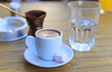 Turkish coffee served on a wooden table