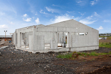 Fototapeta na wymiar Construction of building of new white concrete house