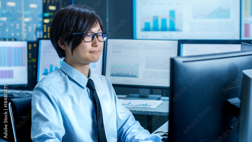Poster In the Data Mining Center Statistician sits at His Workstation Surrounded with Monitors Displaying Data and Graphs.