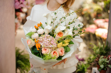 Bright and beautiful valentine bouquet in woman hands