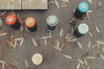top view of cans with colorful spray paint for graffiti