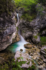 Nemclja waterfall below a natural bridge in Moznica Gorges in  Soca (Trenta) valley, Slovenia.