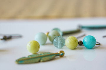 Close-up of scattered beads of natural stones. Gift set. Shallow depth of focus, copy space.