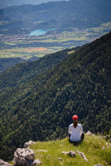 Naklejka premium Young female is admiring majestic views with lake Bled in the distance in Slovenia