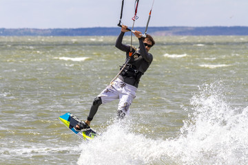 Kiteboarding. Fun in the ocean, Extreme Sport Kitesurfing. Closeup Darkslide.