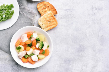 Chicken soup with carrot, broccoli, potato