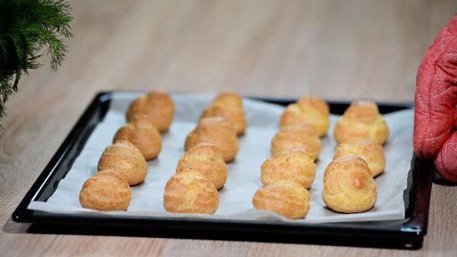 Freshly baked profiteroles in the baking dish
