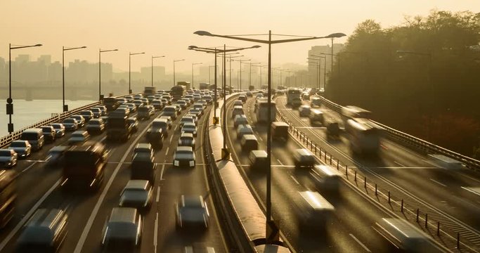 Traffic timelapse on a busy expressway in Seoul at sunrise.