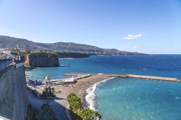 beach, end of swimming season in Sorrento. Concrete blocks used as sea defense in Italy