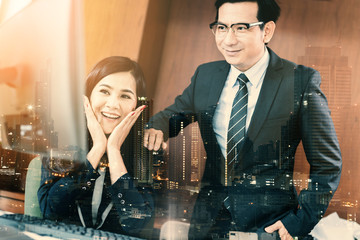 businessman in suit with glasses in office with secretary and blur background business concept