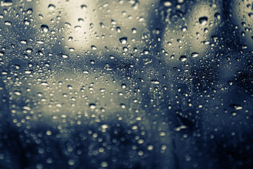 FEEL SAD WITH RAINY SEASON WITH WATER DROP ON CAR WINDOW ON STREET