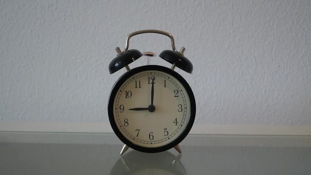 An alarm ringing at 9 o'clock in the morning. Slow motion