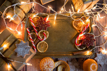 Christmas background with lights, ornaments, candy and decorations. Free space