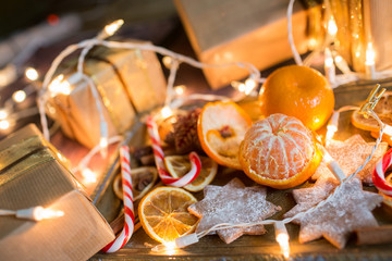 Christmas background with lights, ornaments, candy and decorations. Free space