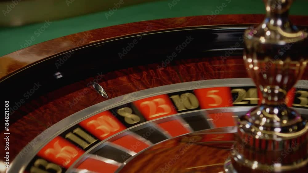 Wall mural Roulette wheel spinning in a casino