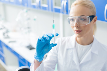 Fototapeta premium Selective focus of medical syringe being ready for usage