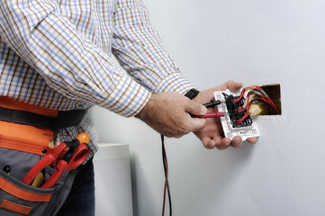 Electrician working in a residential electrical system