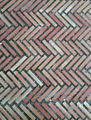 floor paved with bricks in herringbone