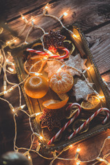 Christmas background with lights, ornaments, candy and decorations. Free space