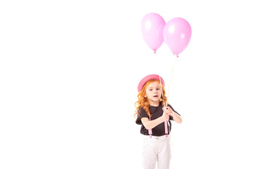 adorable kid standing with pink balloons isolated on white