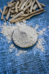 Close up of ayurvedic herb satavari,Asparagus racemosus with its powder and root.