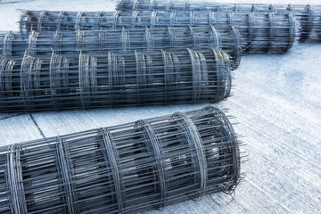 Rolls of steel bar for road construction on concrete road