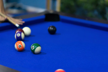Blue Pool table with balls. This is sports.