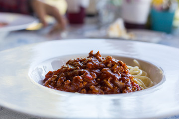 Spaghetti bolognese with cheese  on a plate