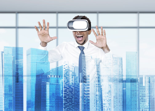 African American businessman in VR glasses, city