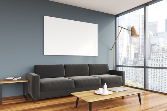 Gray living room, black sofa, poster