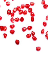 scattered pomegranate grain isolated on white