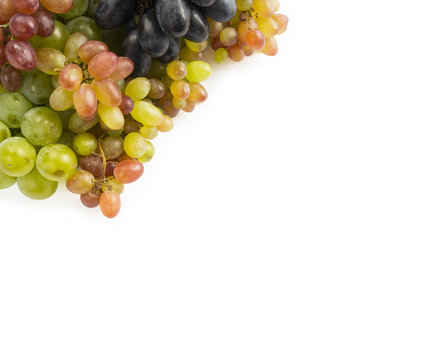 Top view. Grapes on white background. Grapes with copy space for text. Blue, red and green grapes. Vegetarian or healthy eating.
