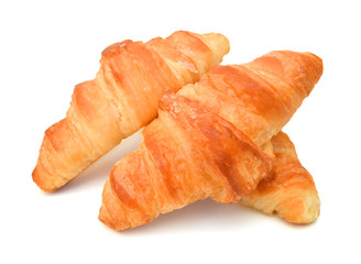 Fresh and tasty croissant over white background 